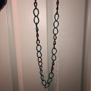 Green and black metal ring, long necklace